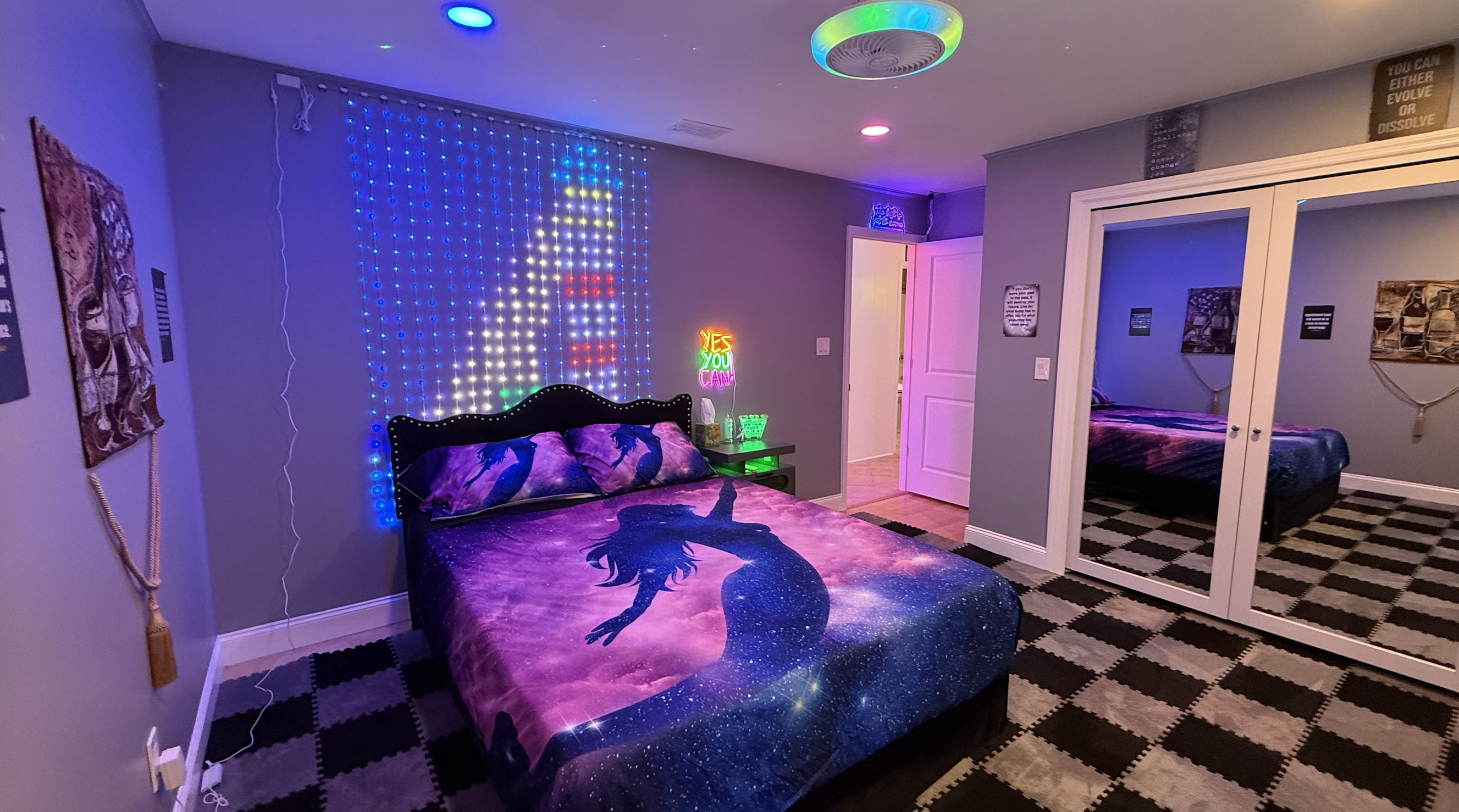 Galaxy-themed bedroom with RGB LED curtain and mirrored closet